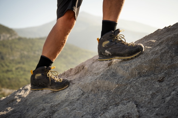 Rear view of a hiker carrying a trekking backpack